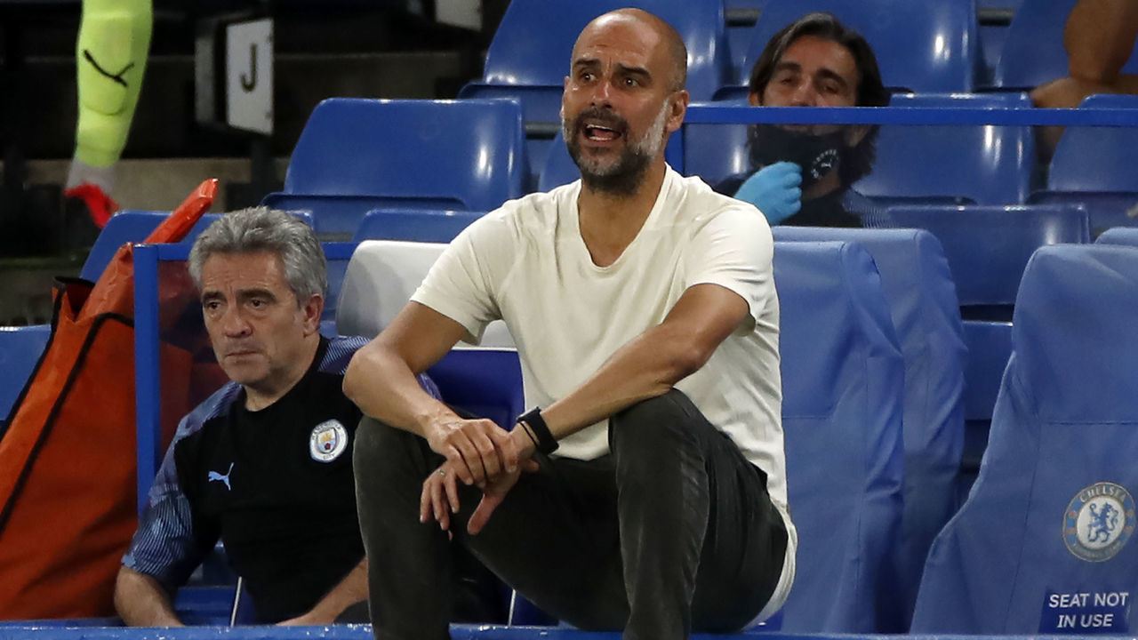 Manchester City's Spanish manager Pep Guardiola reacts during the English Premier League football match between Chelsea and Manchester City at Stamford Bridge in London on June 25, 2020. - Cheslea won the match 2-1. Jurgen Klopp's legendary status at Anfield was secured on Thursday as he became the first Liverpool manager to win a league title in 30 years.