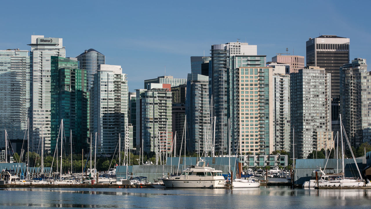 VANCOUVER, CANADA - JUNE 30: The city skyline and Coal Harbour are viewed from Stanley Park on June 30, 2016, in Vancouver, British Columbia, Canada. Vancouver, the largest city in British Columbia, is the most populous city in Western Canada and was the site of the 2010 Winter Olympic Games.