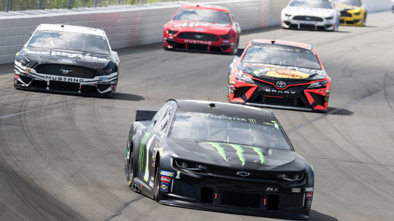 LONG POND, PA - JULY 28: `Kurt Busch driver of the #1 Monster Energy Chevrolet leads a pack of cars into turn 1 during the Monster Energy NASCAR Cup Series, Gander Outdoors 400 on July 28, 2019, at Pocono Raceway in Long Pond, PA.
