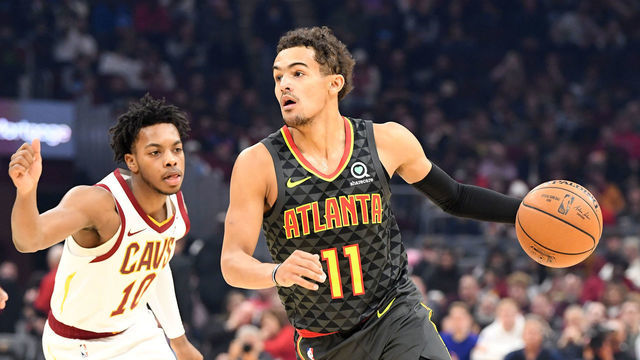 CLEVELAND, OHIO - DECEMBER 23: Trae Young #11 of the Atlanta Hawks drives around Darius Garland #10 of the Cleveland Cavaliers during the first half at Rocket Mortgage Fieldhouse on December 23, 2019 in Cleveland, Ohio. NOTE TO USER: User expressly acknowledges and agrees that, by downloading and/or using this photograph, user is consenting to the terms and conditions of the Getty Images License Agreement.