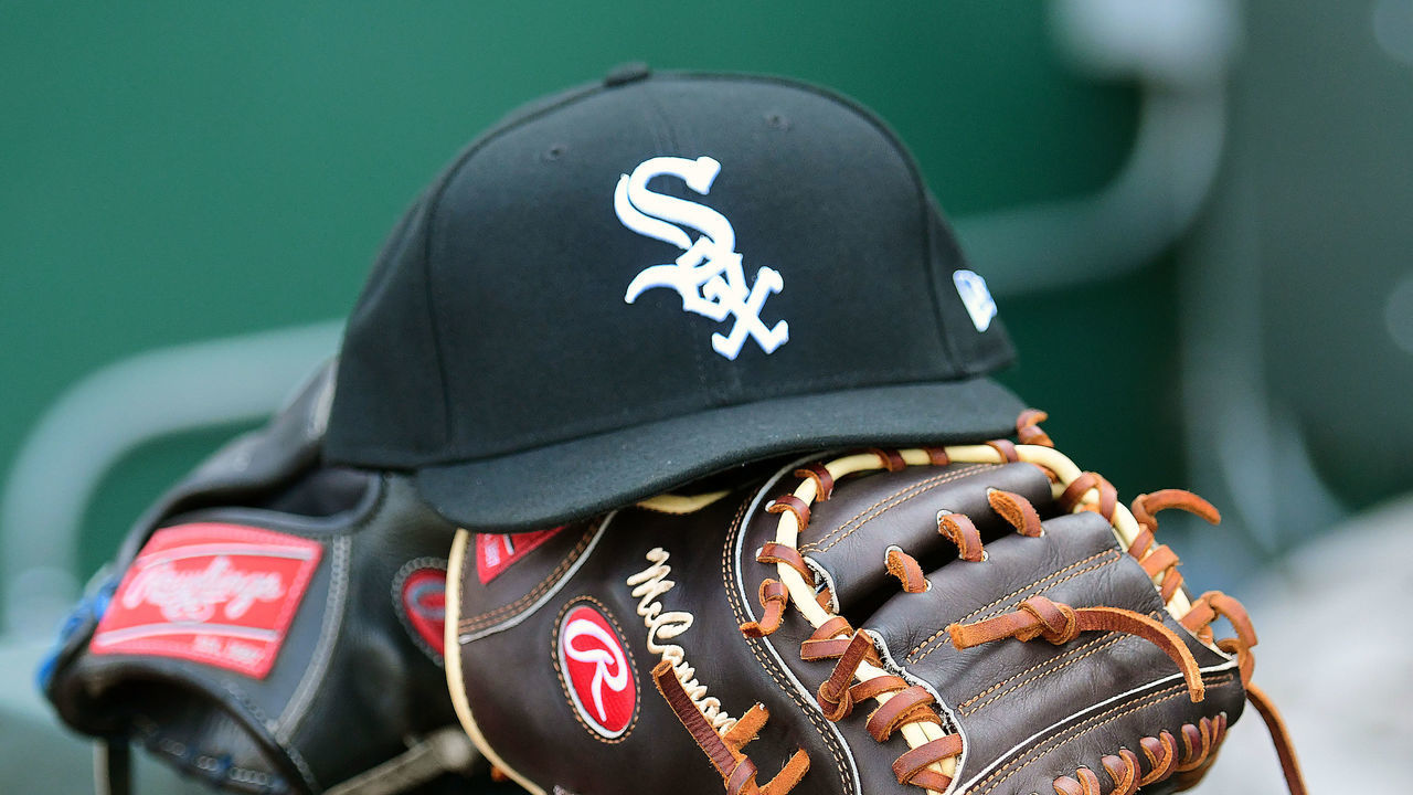 KANSAS CITY, MO. - JULY 17: A White Sox hat and gloves sit ready to be used before a Major League Baseball game between the Chicago White Sox and the Kansas City Royals on July 17, 2019, at Kauffman Stadium, Kansas City, MO.