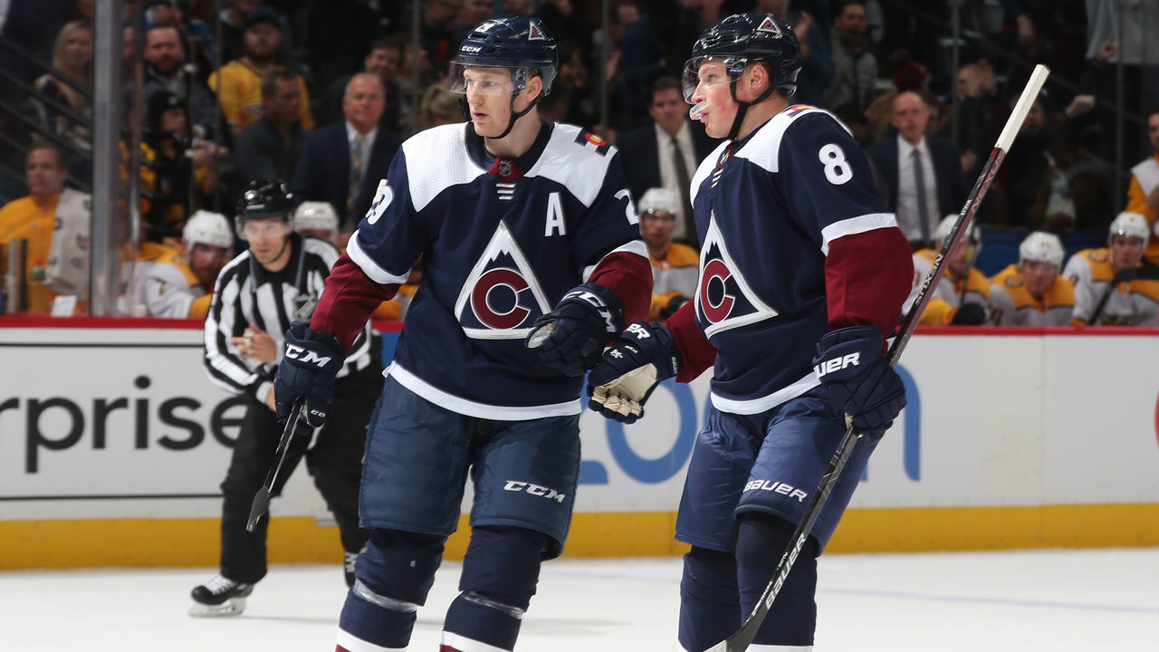 DENVER, COLORADO - NOVEMBER 07: Nathan MacKinnon #29 of the Colorado Avalanche celebrates a goal against the Nashville Predators with teammate Cale Makar #8 at Pepsi Center on November 07, 2019 in Denver, Colorado.