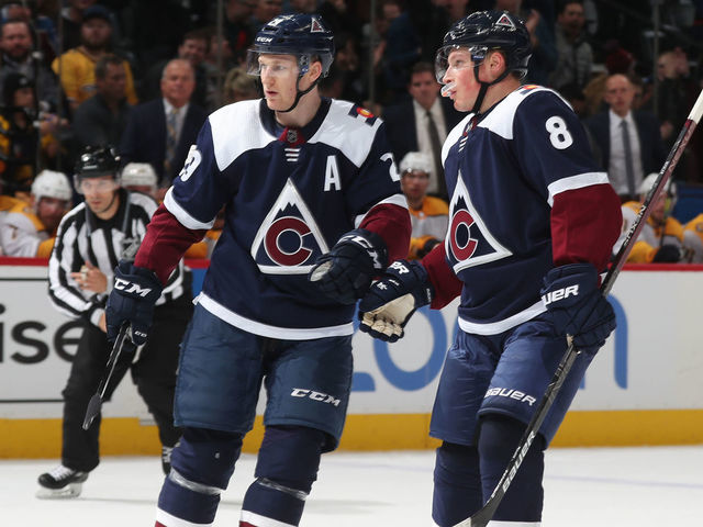 DENVER, COLORADO - NOVEMBER 07: Nathan MacKinnon #29 of the Colorado Avalanche celebrates a goal against the Nashville Predators with teammate Cale Makar #8 at Pepsi Center on November 07, 2019 in Denver, Colorado.