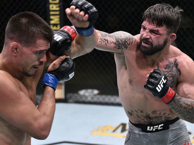 LAS VEGAS, NEVADA - JUNE 27: (R-L) Mike Perry punches Mickey Gall in their welterweight fight during the UFC Fight Night event at UFC APEX on June 27, 2020 in Las Vegas, Nevada.