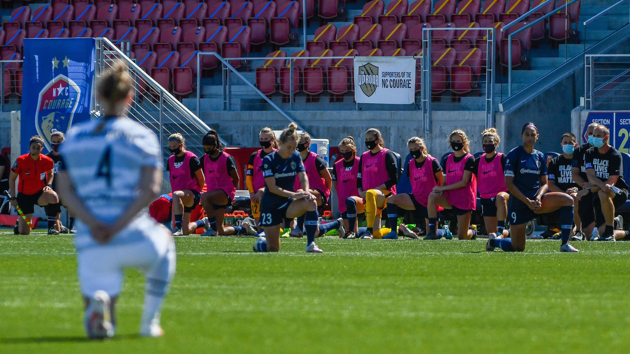 HERRIMAN, UT - JUNE 27: Players from the North Carolina Courage and Portland Thorns FC knee out of respect for the Black Lives Matter movement during the first round of the NWSL Challenge Cup at Zions Bank Stadium on June 27, 2020 in Herriman, Utah.