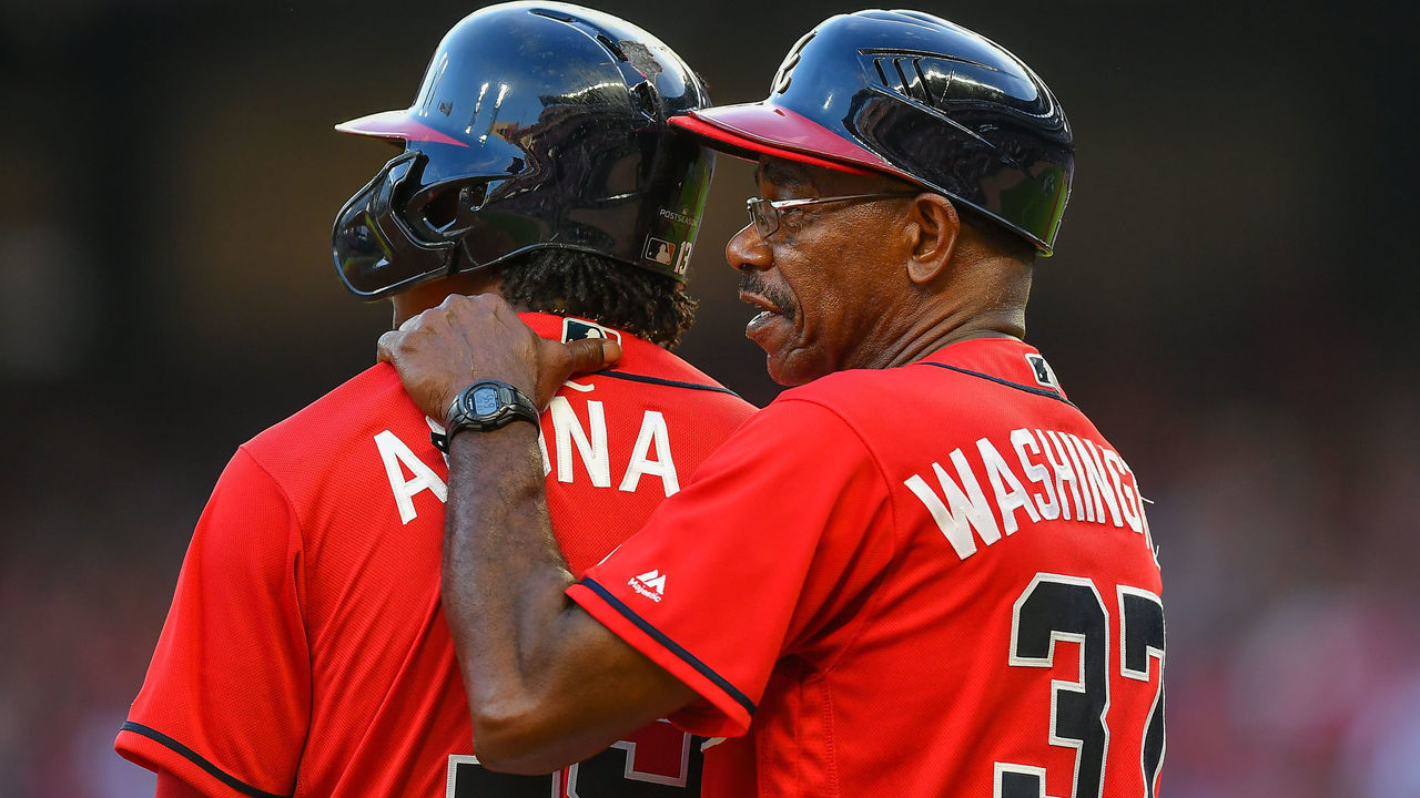 ATLANTA, GA OCTOBER 04: Atlanta Braves third base coach Ron Washington (37) talks with centerfielder Ronald Acuna Jr. (13) during the National League Division Series game 2 between the St. Louis Cardinals and the Atlanta Braves on October 4th, 2019 at SunTrust Park in Atlanta, GA.