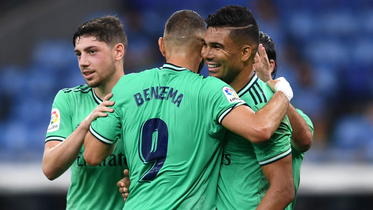 BARCELONA, SPAIN - JUNE 28: Casemiro of Real Madrid celebrates with teammates after scoring his sides first goal during the Liga match between RCD Espanyol and Real Madrid CF at RCDE Stadium on June 28, 2020 in Barcelona, Spain.