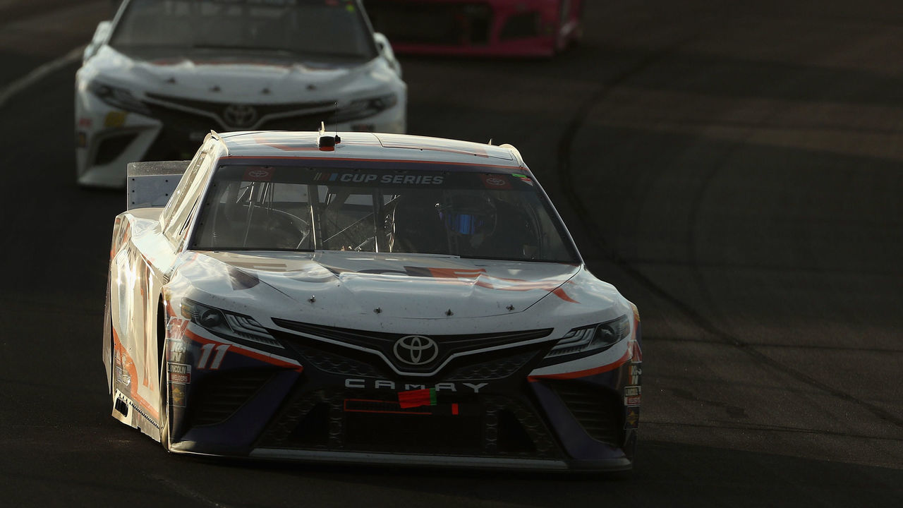 LONG POND, PENNSYLVANIA - JUNE 28: Denny Hamlin, driver of the #11 FedEx Ground Toyota, leads a pack of cars during the NASCAR Cup Series Pocono 350 at Pocono Raceway on June 28, 2020 in Long Pond, Pennsylvania.