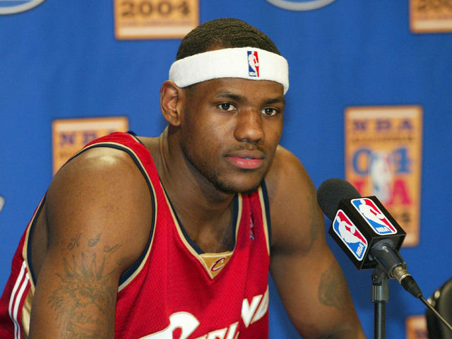 LOS ANGELES - FEBRUARY 13: LeBron James #23 of the rookie team speaks during a news conference before the Got Milk? Rookie Challenge game, part of the 53rd NBA All-Star weekend at Staples Center February 13, 2004 in Los Angeles, California. NOTE TO USER: User expressly acknowledges and agrees that, by downloading and/or using this Photograph, User is consenting to the terms and conditions of the Getty Images License Agreement.
