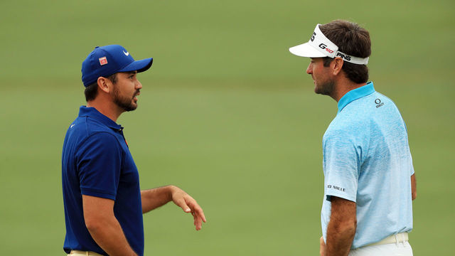 AUGUSTA, GEORGIA - APRIL 14: (L-R) Jason Day of Australia and Bubba Watson of the United States talk on the second green during the final round of the Masters at Augusta National Golf Club on April 14, 2019 in Augusta, Georgia.