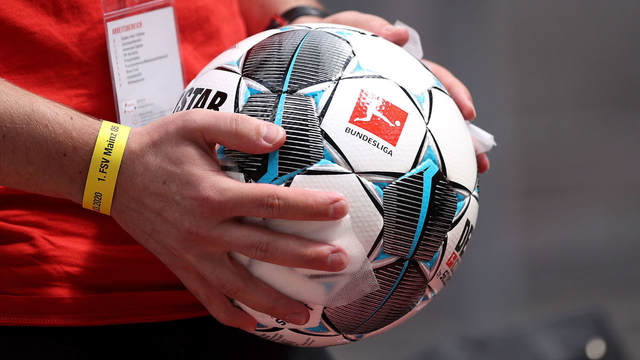 COLOGNE, GERMANY - MAY 17: Ball boys disinfect the footballs ahead of the Bundesliga match between 1. FC Koeln and 1. FSV Mainz 05 at RheinEnergieStadion on May 17, 2020 in Cologne, Germany. The Bundesliga and Second Bundesliga is the first professional league to resume the season after the nationwide lockdown due to the ongoing Coronavirus (COVID-19) pandemic. All matches until the end of the season will be played behind closed doors.