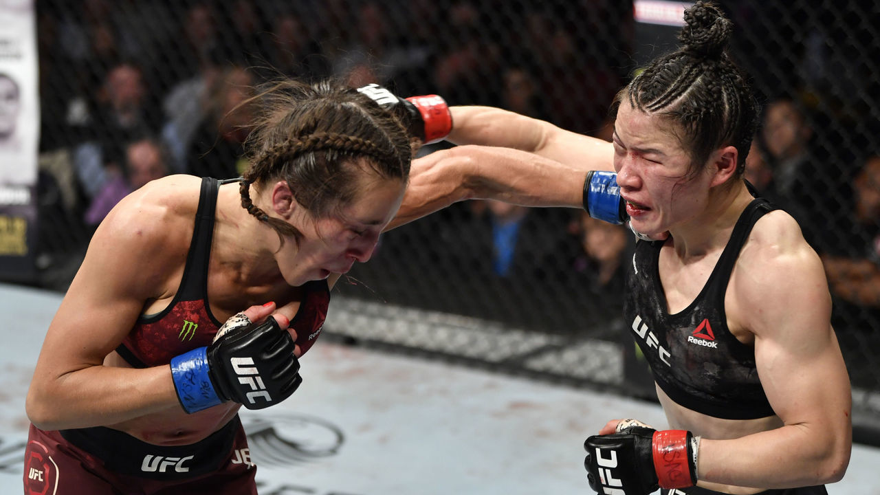 LAS VEGAS, NEVADA - MARCH 07: (L-R) Joanna Jedrzejczyk of Poland punches Zhang Weili of China in their UFC strawweight championship fight during the UFC 248 event at T-Mobile Arena on March 07, 2020 in Las Vegas, Nevada.