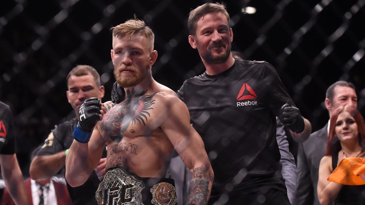 12 December 2015; UFC featherweight champion Conor McGregor with coach John Kavanagh following defeating Jose Aldo. UFC 194: Jose Aldo v Conor McGregor, MGM Grand Garden Arena, Las Vegas, USA. Picture credit: Ramsey Cardy / SPORTSFILE