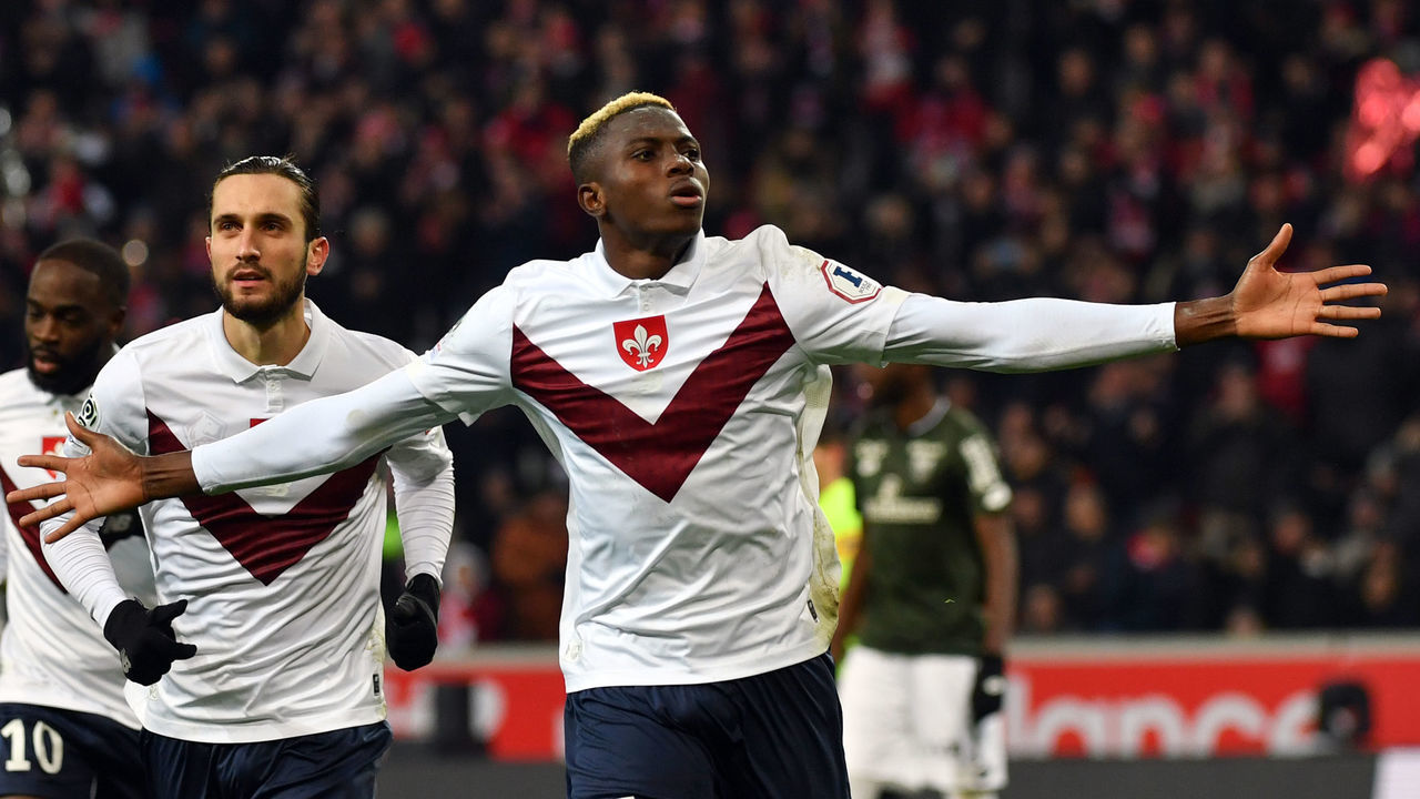 Lille's Nigerian forward Victor Osimhen (R) celebrates after scoring a goal during the French L1 football match between Lille (LOSC) and Dijon (DFCO) at the Pierre-Mauroy Stadium in Villeneuve d'Ascq, near Lille, northern France, on November 30, 2019.