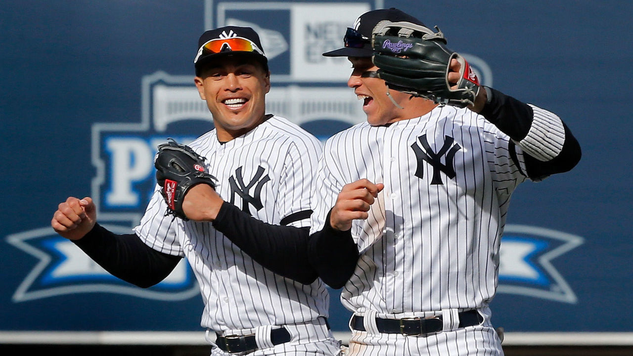 NEW YORK, NY - MARCH 28: (NEW YORK DAILIES OUT) Giancarlo Stanton #27 (L) and Aaron Judge #99 of the New York Yankees celebrate after defeating the Baltimore Orioles on Opening Day at Yankee Stadium on March 28, 2019 in the Bronx borough of New York City. The Yankees defeated the Orioles 7-2.