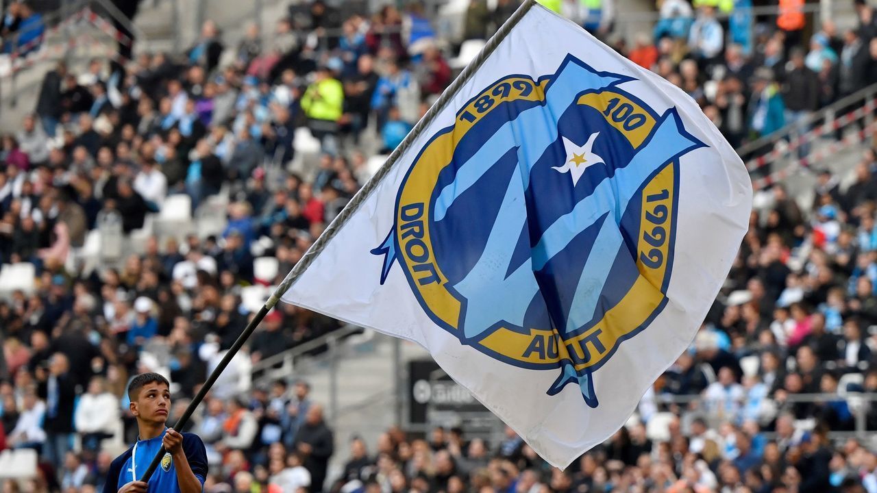 Olympique Marseille's flag with the logo is waved prior to the French L1 football match between Olympique de Marseille (OM) and Football Club de Nantes (FCN) at the Velodrome Stadium in Marseille, southern France, on February 22, 2020. - Nantes won 3-1.