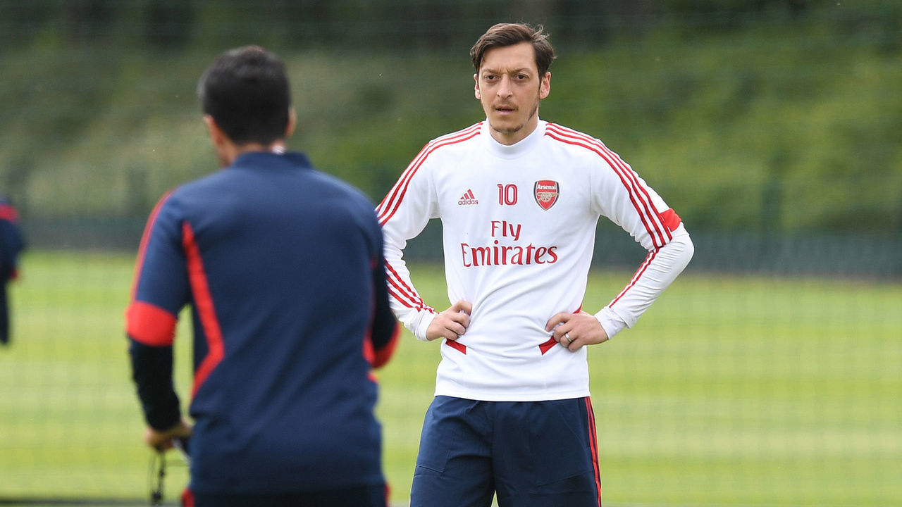 ST ALBANS, ENGLAND - JUNE 09: Mesut Ozil listens to Arsenal Head Coach Mikel Arteta during a training session at London Colney on June 09, 2020 in St Albans, England.