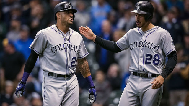 MILWAUKEE, WISCONSIN - APRIL 30: Ian Desmond #20 and Nolan Arenado #28 of the Colorado Rockies celebrate after Desmond hit a home run in the ninth inning against the Milwaukee Brewers at Miller Park on April 30, 2019 in Milwaukee, Wisconsin.
