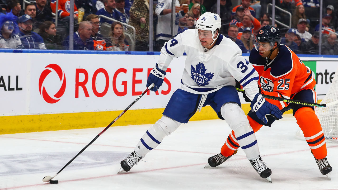 EDMONTON, AB - DECEMBER 14: Toronto Maple Leafs Center Auston Matthews (34) holds off Edmonton Oilers Defenceman Darnell Nurse (25) in the second period during the Edmonton Oilers game versus the Toronto Maple Leads on December 14, 2019 at Rogers Place in Edmonton, AB.