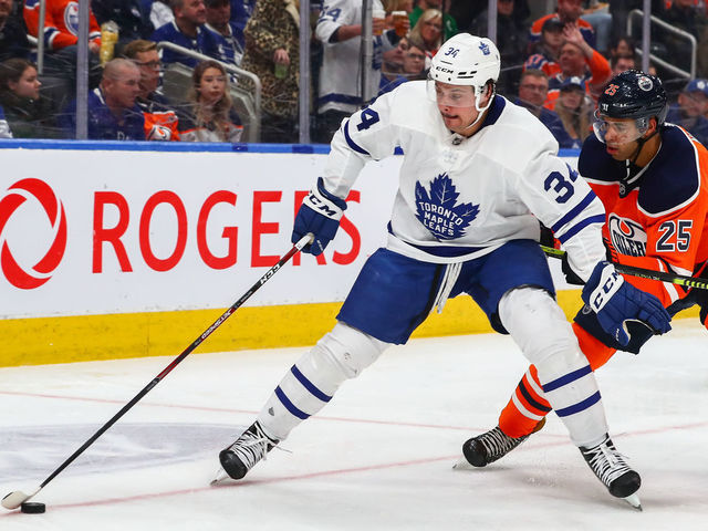 EDMONTON, AB - DECEMBER 14: Toronto Maple Leafs Center Auston Matthews (34) holds off Edmonton Oilers Defenceman Darnell Nurse (25) in the second period during the Edmonton Oilers game versus the Toronto Maple Leads on December 14, 2019 at Rogers Place in Edmonton, AB.