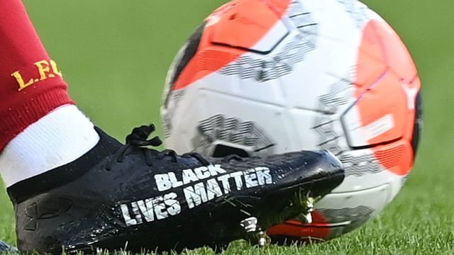 Black Lives Matter is seen on the boot of Liverpool's English defender Trent Alexander-Arnold during the English Premier League football match between Everton and Liverpool at Goodison Park in Liverpool, north west England on June 21, 2020.