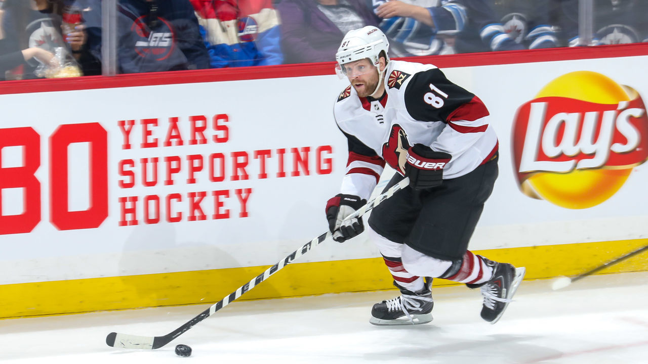 WINNIPEG, MB - MARCH 9: Phil Kessel #81 of the Arizona Coyotes plays the puck down the ice during first period action against the Winnipeg Jets at the Bell MTS Place on March 9, 2020 in Winnipeg, Manitoba, Canada. The Jets defeated the Coyotes 4-2.