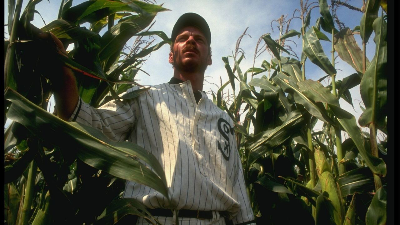 DYERSVILLE, IA - AUGUST 25: A "ghost player" in a vintage Chicago White Sox baseball uniform emerges from a cornfield as he re-enacts the scene at the baseball field created for the motion picture 'Field of Dreams' on August 25, 1991 in Dyersville, Iowa. Rita and Al Ameskamp who, with Don and Becky Lansing, co-own the site have turned the cornfields and baseball diamond into a summertime tourist attraction, including "ghost player" reenactments.