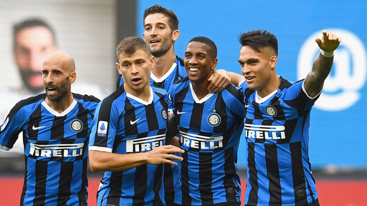 MILAN, ITALY - JULY 01: Ashley Young of FC Internazionale celebrates with teammates after scoring the opening goal during the Serie A match between FC Internazionale and Brescia Calcio at Stadio Giuseppe Meazza on July 1, 2020 in Milan, Italy.