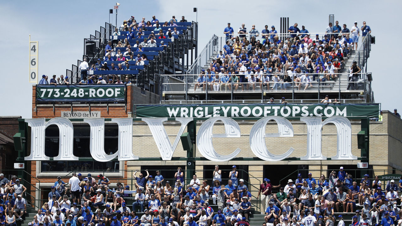CHICAGO, IL - JUNE 21: General view of the Nuveen Investments sign and Wrigley rooftop seating in rear as the Chicago Cubs play against the San Diego Padres during a game at Wrigley Field on June 21, 2017 in Chicago, Illinois. The Padres defeated the Cubs 3-2. *** Local Caption ***