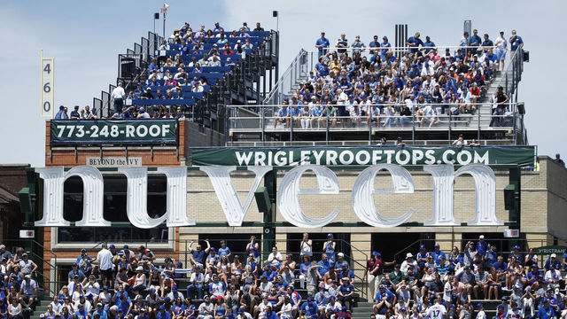 CHICAGO, IL - JUNE 21: General view of the Nuveen Investments sign and Wrigley rooftop seating in rear as the Chicago Cubs play against the San Diego Padres during a game at Wrigley Field on June 21, 2017 in Chicago, Illinois. The Padres defeated the Cubs 3-2. *** Local Caption ***