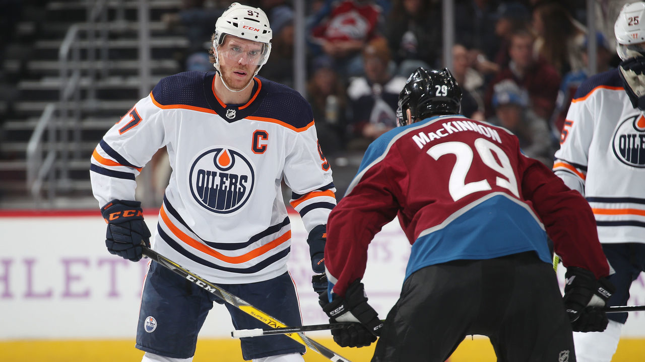 DENVER, COLORADO - NOVEMBER 27: Nathan MacKinnon #29 of the Colorado Avalanche faces off against Connor McDavid #97 of the Edmonton Oilers at the Pepsi Center on November 27, 2019 in Denver, Colorado. The Avalanche defeated the Oilers 4-1.