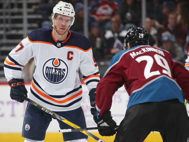 DENVER, COLORADO - NOVEMBER 27: Nathan MacKinnon #29 of the Colorado Avalanche faces off against Connor McDavid #97 of the Edmonton Oilers at the Pepsi Center on November 27, 2019 in Denver, Colorado. The Avalanche defeated the Oilers 4-1.