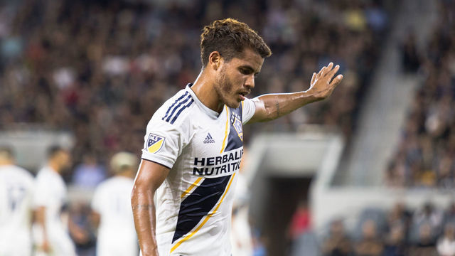 LOS ANGELES, CA - AUGUST 25 : Jonathan dos Santos #8 of the Los Angeles Galaxy walking to the corner flag at Banc of California Stadium on August 25, 2019 in Los Angeles, California.