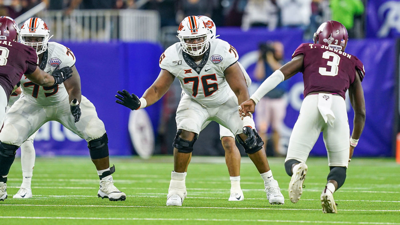 HOUSTON, TX - DECEMBER 27: Oklahoma State Cowboys offensive lineman Dylan Galloway (76) gets ready to block Texas A&M Aggies defensive lineman Tyree Johnson (3) during the college football game between the Oklahoma State Cowboys and Texas A&M Aggies on December 27, 2019 at NRG Stadium in Houston, TX.