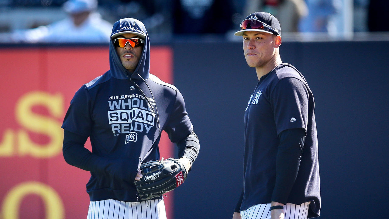 TAMPA, FLORIDA - MARCH 06: Giancarlo Stanton #27 and Aaron Judge #99 of the New York Yankees look on before the Grapefruit League spring training game against the St. Louis Cardinals at Steinbrenner Field on March 06, 2019 in Tampa, Florida.