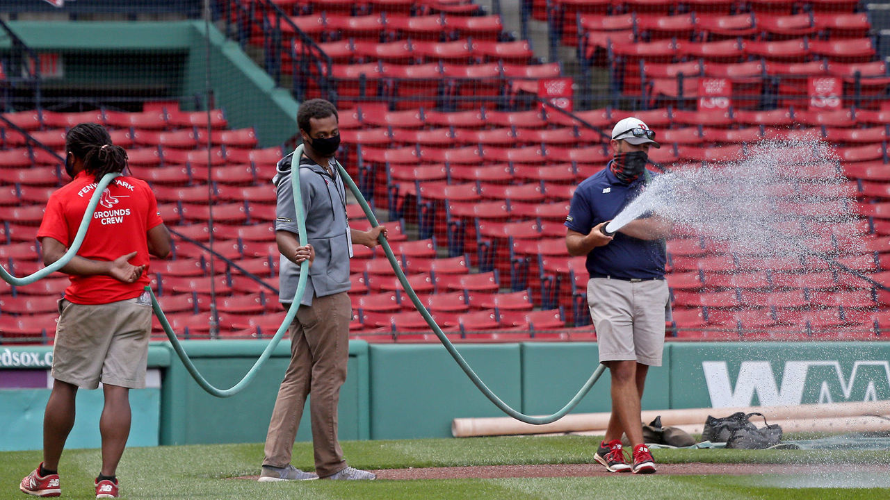 BOSTON, MA. - JULY 2: Fenway Park groundskeepers water down the infield a day before the start of Red Sox Summer Camp on July 2, 2020 in Boston, Massachusetts. (Staff Photo By Matt Stone/ MediaNews Group/Boston Herald)
