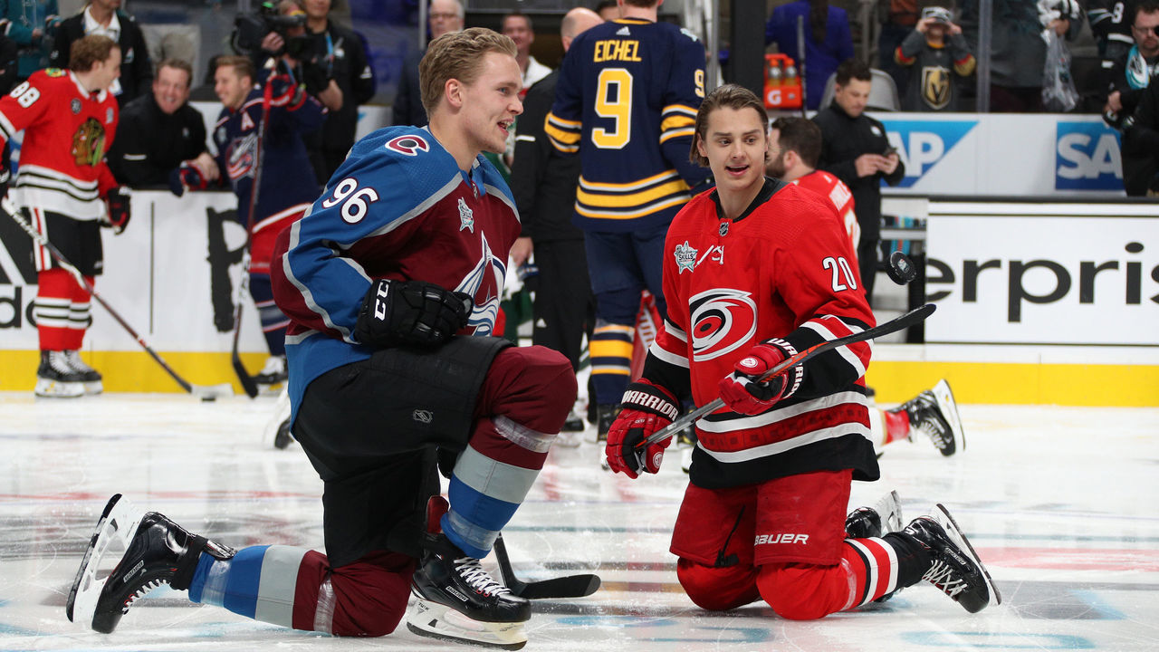 SAN JOSE, CA - JANUARY 25: Mikko Rantanen #96 of the Colorado Avalanche and Sebastian Aho #20 of the Carolina Hurricanes stretch during warm-up prior to the 2019 SAP NHL All-Star Skills at SAP Center on January 25, 2019 in San Jose, California.