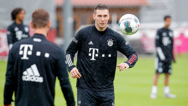 MUNICH, GERMANY - JUNE 19: Niklas Suele of FC Bayern Muenchen eyes the ball during a training session at Saebener Strasse training ground on June 19, 2020 in Munich, Germany.