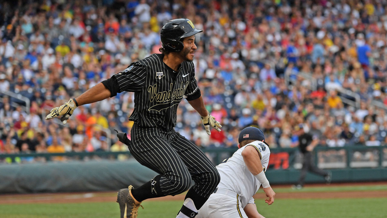 OMAHA, NE - JUNE 25: Austin Martin #16 of the Vanderbilt Commodores gets thrown out at first base in the third inning against the Michigan Wolverines during game two of the College World Series Championship Series on June 25, 2019 at TD Ameritrade Park Omaha in Omaha, Nebraska.
