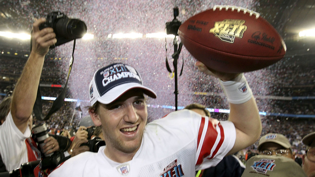 GLENDALE, AZ - FEBRUARY 03: Quarterback Eli Manning #10 of the New York Giants reacts after the Giants defeated the New England Patriots 17-14 during Super Bowl XLII on February 3, 2008 at the University of Phoenix Stadium in Glendale, Arizona.
