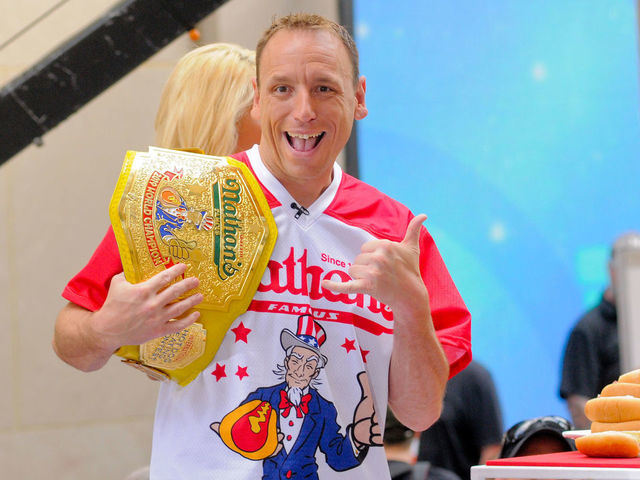 TODAY SHOW PLAZA, NEW YORK CITY, NY, UNITED STATES - 2019/07/05: Competitive Eater, Joey Chestnut seen during Country Music Star, Toby Keith's performance in New York City on NBC's Today Show.