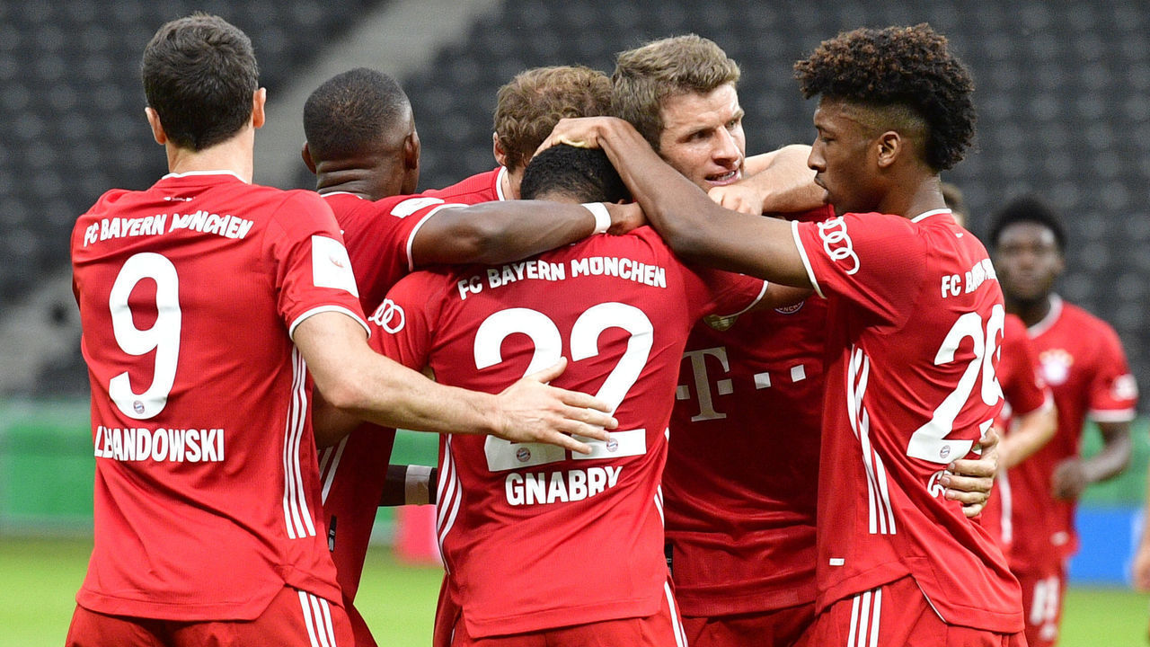Bayern Munich's German midfielder Serge Gnabry (C) celebrates scoring his team's second goal with team mates during the German Cup (DFB Pokal) final football match Bayer 04 Leverkusen v FC Bayern Munich at the Olympic Stadium in Berlin on July 4, 2020.