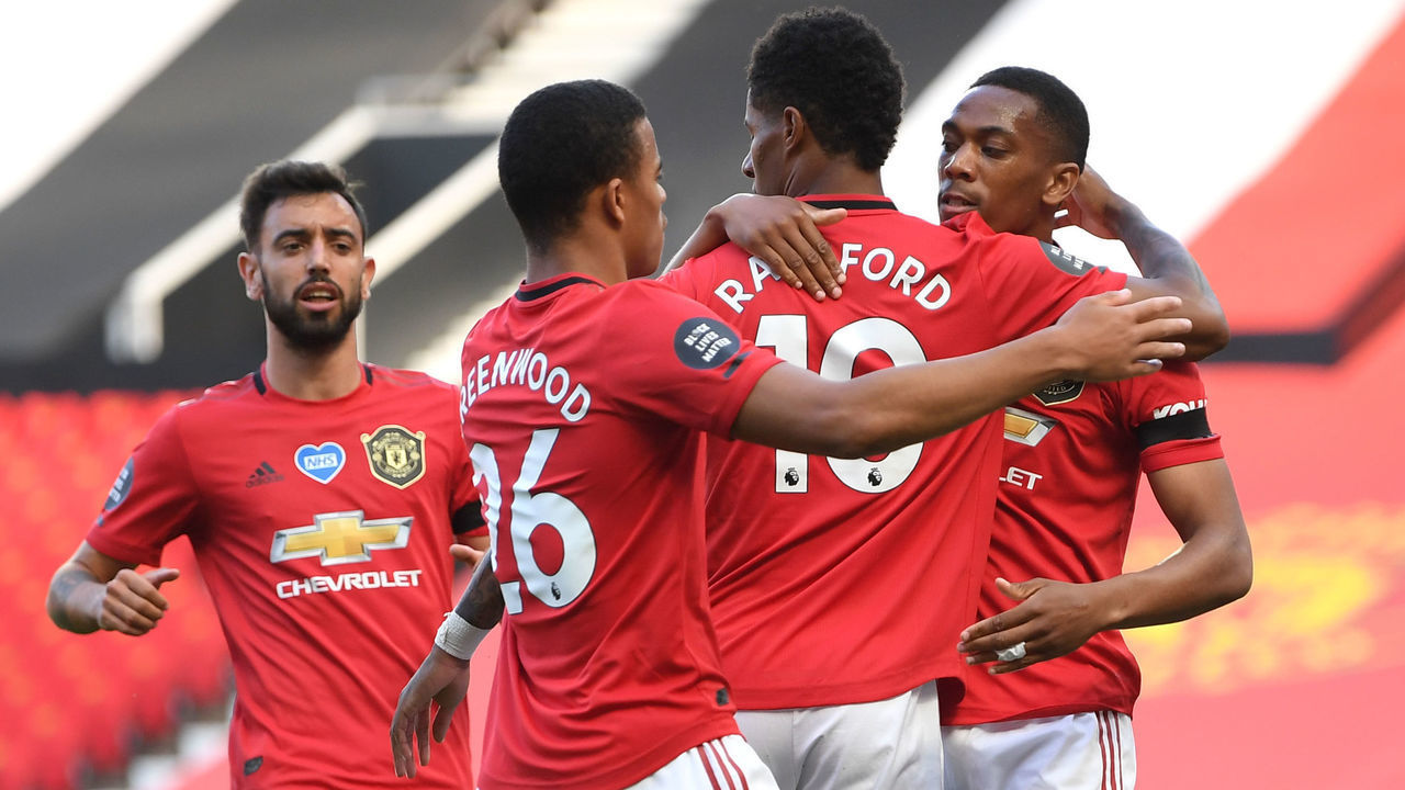 MANCHESTER, ENGLAND - JUNE 24: Anthony Martial of Manchester United celebrates with Marcus Rashford and Mason Greenwood after scoring his team's first goal during the Premier League match between Manchester United and Sheffield United at Old Trafford on June 24, 2020 in Manchester, England.