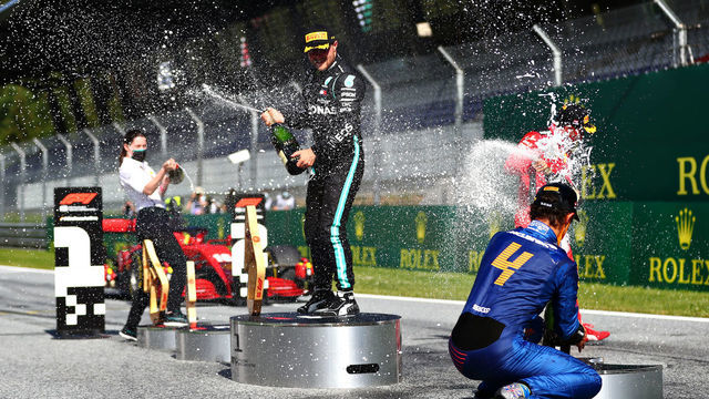 SPIELBERG, AUSTRIA - JULY 05: Race winner Valtteri Bottas of Finland and Mercedes GP, second placed Charles Leclerc of Monaco and Ferrari and third placed Lando Norris of Great Britain and McLaren F1 celebrate on the podium during the Formula One Grand Prix of Austria at Red Bull Ring on July 05, 2020 in Spielberg, Austria.