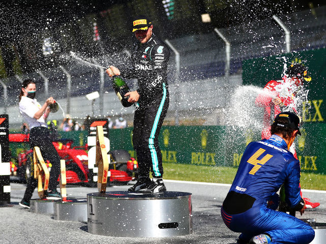 SPIELBERG, AUSTRIA - JULY 05: Race winner Valtteri Bottas of Finland and Mercedes GP, second placed Charles Leclerc of Monaco and Ferrari and third placed Lando Norris of Great Britain and McLaren F1 celebrate on the podium during the Formula One Grand Prix of Austria at Red Bull Ring on July 05, 2020 in Spielberg, Austria.