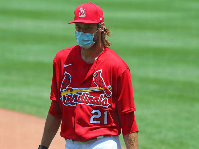 ST. LOUIS, MO - JULY 3: Andrew Miller #21 of the St. Louis Cardinals returns to the dugout during the first day of summer workouts at Busch Stadium on July 3, 2020 in St. Louis, Missouri.