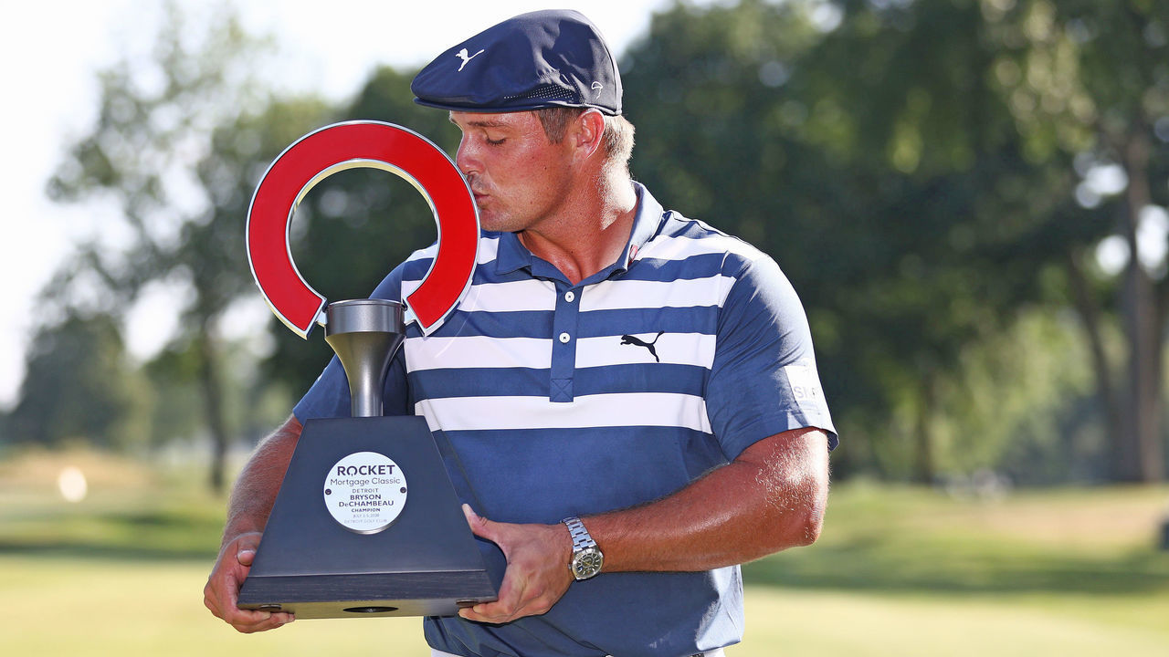 DETROIT, MICHIGAN - JULY 05: Bryson DeChambeau of the United States celebrates with the trophy after winning during the final round of the Rocket Mortgage Classic on July 05, 2020 at the Detroit Golf Club in Detroit, Michigan.