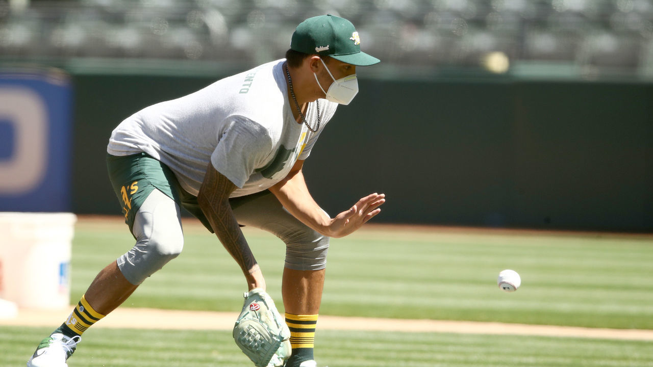 OAKLAND, CALIFORNIA - JULY 05: Sean Manaea #55 of the Oakland Athletics fields a ground ball during summer workouts at RingCentral Coliseum on July 05, 2020 in Oakland, California.