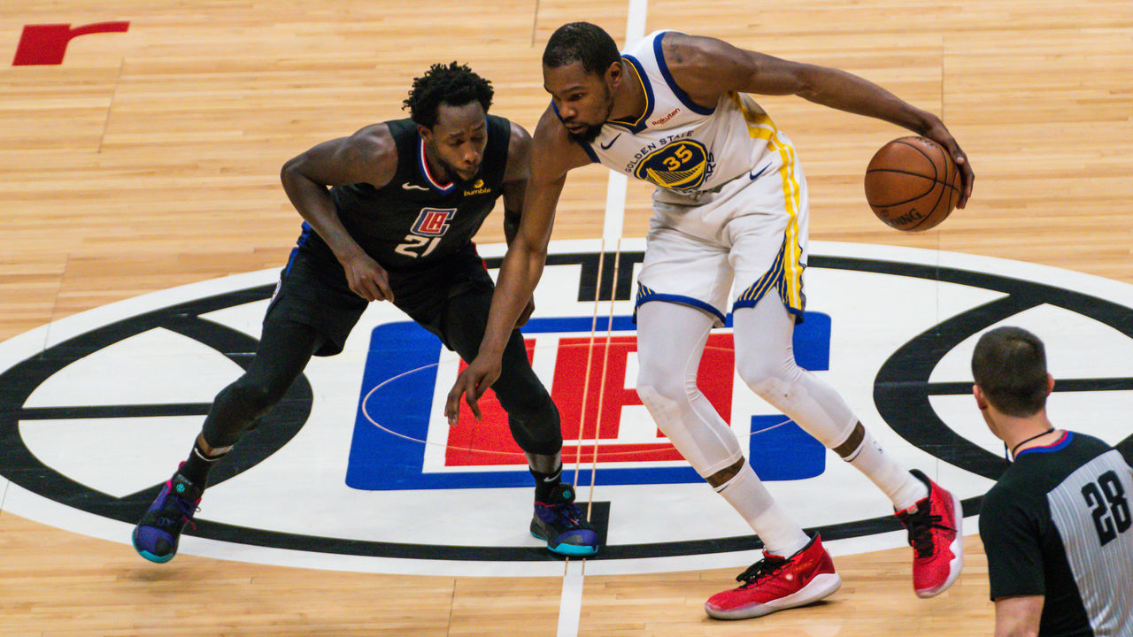 LOS ANGELES, CALIFORNIA - APRIL 26: Kevin Durant of the Golden State Warriors handles the ball against Patrick Beverly of the Los Angeles Clippers during a game at Staples Center on April 26, 2019 in Los Angeles, California.