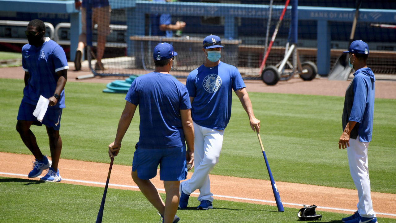 LOS ANGELES, CA - JULY 03: Players talk in the infield wearing masks during the Los Angeles Dodgers first summer camp workout in preparation for the 2020 season due to the Coronavirus Pandemic in Los Angeles on Friday, July 3, 2020.